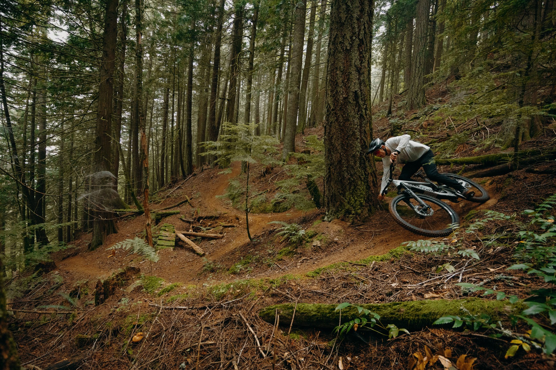 Jasper Jauch riding a trail in the woods